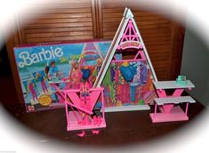 the barbie doll house is set up in front of the barbie's picnic table