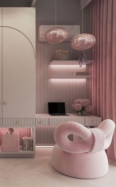 a room with pink furniture and hanging lights