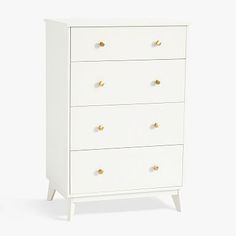 a white dresser with gold knobs on the top and bottom drawers, against a white background