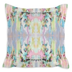 a pillow with an abstract design on the front and back, in pastel colors