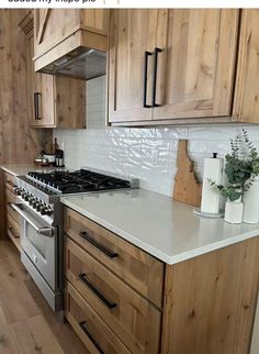 a kitchen with wooden cabinets and white counter tops