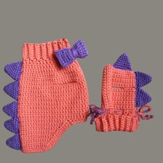 two knitted mittens and gloves are shown in pink, purple, and blue