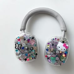 the hello kitty headphones are decorated with jewels