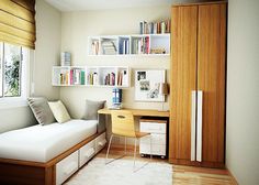 a bedroom with a bed, desk and bookshelf in it's corner