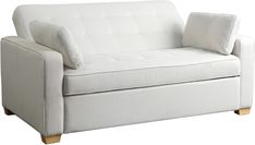 a white couch with two pillows on it