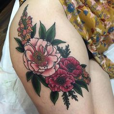 a woman's thigh with flowers on it