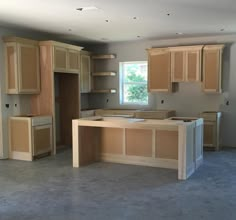 an empty kitchen with wooden cabinets and no one in the room to be used for cooking