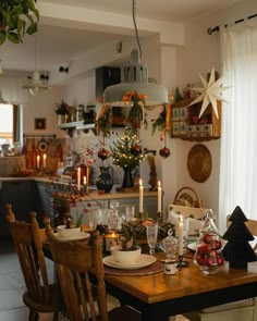 a dining room table set for christmas dinner