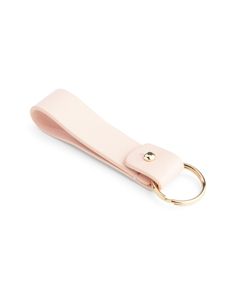 a pink leather keychain with a gold ring on the front and back side