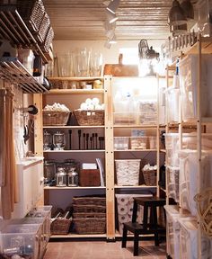 a room filled with lots of shelves and baskets on top of it's sides