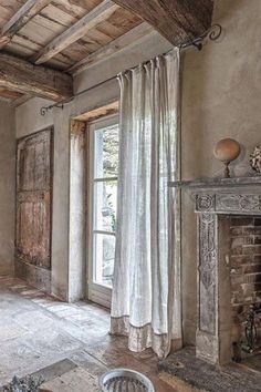 a living room with a fire place and stone fireplace