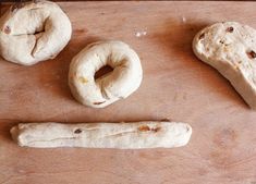 doughnuts and pretzels sitting on a cutting board