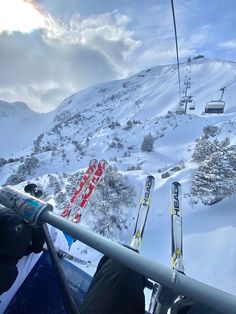 the skiers are going down the mountain on their skis and snowboarders