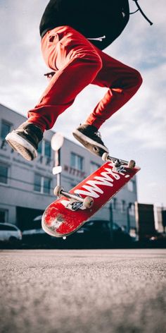 a person jumping in the air on a skateboard