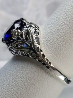 blue sapphire solitaire ring with swirl antique floral sterling silver filigree Gothic Sapphire Ring, Gothic Victorian Rings, Victorian Sapphire Ring, Sapphire Ring In Sterling Silver With Intricate Design, Sapphire Filigree Ring In Sterling Silver, Silver Sapphire Filigree Ring, Silver Filigree Sapphire Ring, Silver Sapphire Ring With Filigree, Sterling Silver Sapphire Filigree Ring