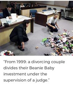 two people kneeling down on the floor in an office