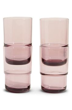 two pink glasses sitting next to each other