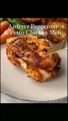 the cover of an air fryer pepperoni and pesto chicken melt recipe on a white plate