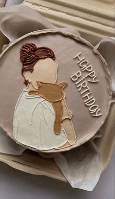 a birthday cake with a woman's profile on it