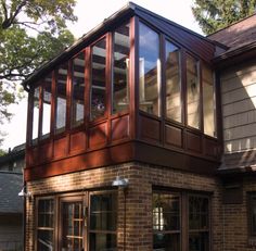 a large brown brick building with lots of windows