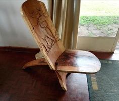 a wooden bench sitting on top of a hard wood floor next to a window with curtains