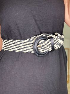 Just can't go wrong with black and white, especially with this two tone braided belt. It makes the perfect accent to your next outfit or maxi dress. It features a braided design and a partial circle buckle style. Details braided design black and white length 44" width 1.75" 100% polyester Chic Woven Belts For Beach, Chic Woven Belt For Beach, Chic Adjustable Rope Belt, Chic Woven Belts For The Beach, Casual Black Belt For Summer, Trendy Black Belt For Summer, Casual Woven Belts For Spring, Chic Belts For Spring Vacation, Black Fabric Belt For Summer