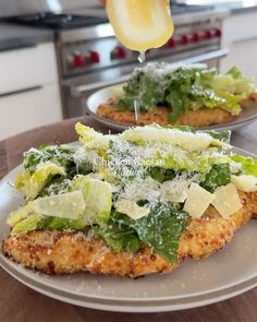 two plates with food on them sitting on a table