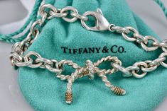 Tiffany & Co. 14K Gold & Silver Twist Ribbon Bow 8" Bracelet CUSTOMIZED (Originally a Brooch, Turned into a Bracelet using Tiffany Links & Clasp) 100% Authentic Tiffany Components were used to make Bracelet Polished and Cleaned to Look New! Hallmark: Tiffany & Co. STER 14KT Comes with Tiffany Pouch 30 Day Returns accepted! Large Family Love Tiffany, Make Bracelet, Twisted Ribbons, Bow Bracelet, Tiffany Heart, Ribbon Bow, A Bracelet, Heart Charm Bracelet, Ribbon Bows