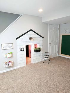 there is a dog house built into the wall in this room with no one inside