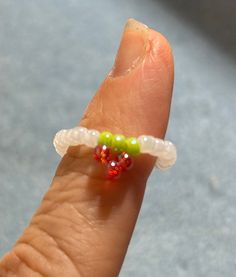 Strawberry bead ring.  Colors are red, green and white.  Can mix and match colors.  All sizes available. Green Beaded Rings For Gifts, Green Beaded Rings For Gift, Handmade Adjustable White Rings, White Adjustable Casual Rings, Casual White Adjustable Rings, Red Beaded Rings For Gifts, Red Beaded Rings As Gift, Red Beaded Rings Perfect As Gifts, Adjustable White Rings With Tiny Beads