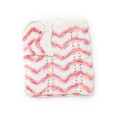 a crocheted blanket with pink and white chevrons