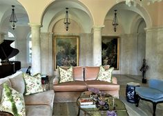 a living room filled with furniture and a grand piano