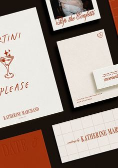 the stationery is laid out on top of each other, including business cards and envelopes