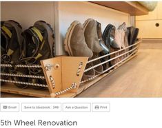 a shelf filled with lots of shoes on top of a wooden floor