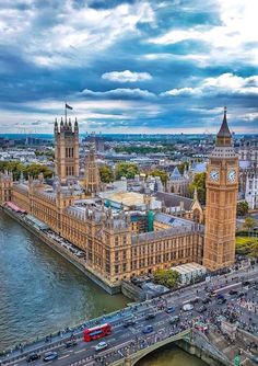 the big ben clock tower towering over the city of london and river thames, england