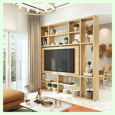 a living room filled with furniture and a flat screen tv on top of a wooden shelf