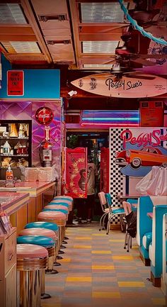 the inside of a diner with colorful booths