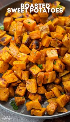 roasted sweet potatoes in a pan with herbs and seasoning on the side text reads roasted sweet potatoes