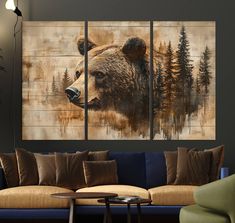 a living room with a couch and three paintings on the wall, one bear is looking at the camera