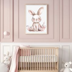 a baby's room with pink walls and a white crib