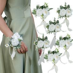 bridesmaid's bouquets with white flowers and greenery are shown in this image