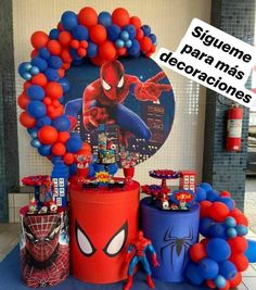 a spiderman birthday party with balloons and decorations