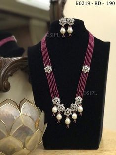 Pretty floral designer long mala/ designer necklace / ad jewelery/ kundan jewelery/ long necklace / punjabi jewellery / pakistani jewelry Beautiful long necklace made in real onex beads with pretty floral design in faux american diamond paired with cute earrings. Beads used in necklace is real onex crystal beads glass made NO PLASTIC Easy to wear, Light in weight & gives you a classy Look. It can be wear in festival occasion with matching salwar suit, saree or any traditional  Polki,AD Diamond N Luxury Temple Jewelry Necklace With Dangling Beads, Long Moti Necklace, Punjabi Jewellery, Beautiful Beaded Necklaces, Black Beads Mangalsutra Design, Earrings Beads, Fancy Jewelry Necklace, Pearl Jewelry Design, Pearl Necklace Designs