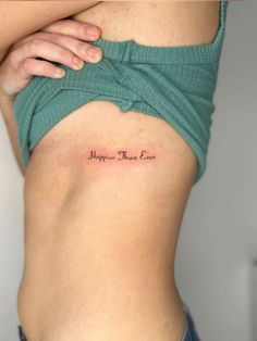 a woman's stomach with the words hope, truth and love tattooed on it