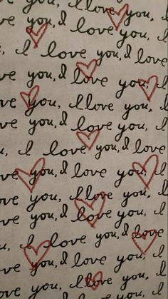 an old handwritten love letter with red hearts and the words i love you written in cursive writing