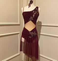 a dress on display in front of a door