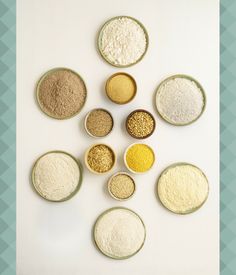 seven bowls filled with different types of food on top of a white countertop next to each other