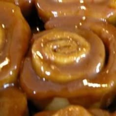 there are many glazed doughnuts stacked on top of each other in this pile