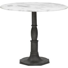 a white marble top table with black metal pedestals and an iron base, on a white background