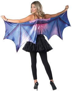 a woman wearing a costume with a bat on it's chest and wings over her shoulder